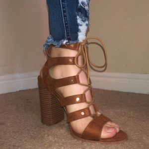 Brown strappy heels.